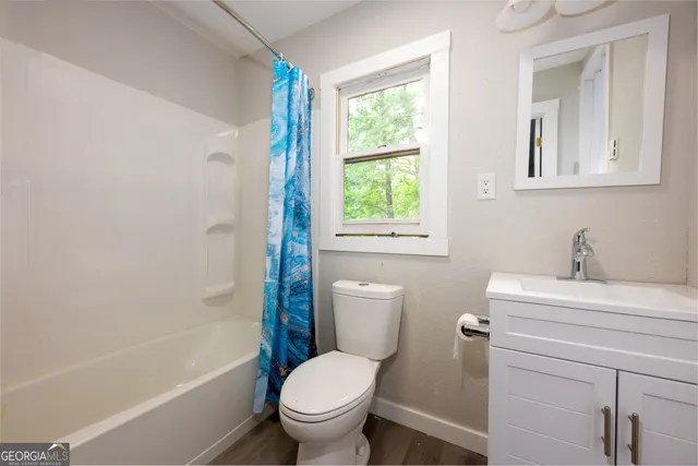 a view of a small house with a deck