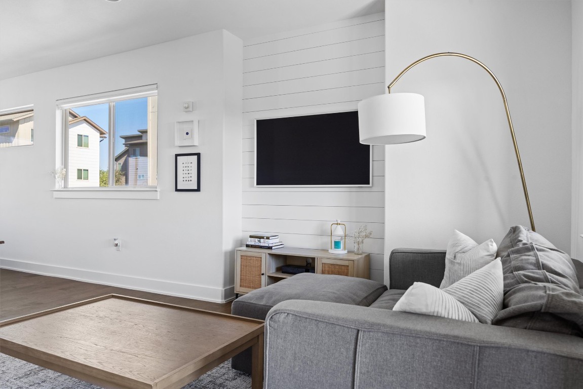 5315 La Crosse Avenue, Unit 18 Austin, TX 78739 - Photo 11 of 40 Living area with wood finished floors and accent walls