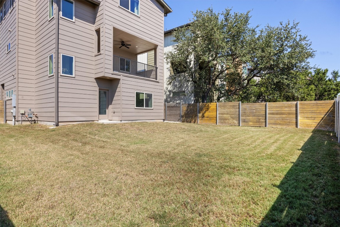 5315 La Crosse Avenue, Unit 18 Austin, TX 78739 - Photo 34 of 40 Fenced backyard featuring balcony