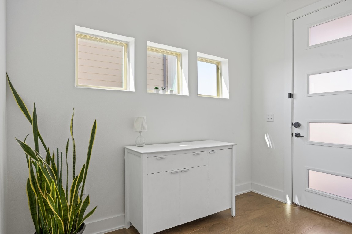 5315 La Crosse Avenue, Unit 18 Austin, TX 78739 - Photo 4 of 40 Foyer with dark wood-type flooring and healthy amount of natural light