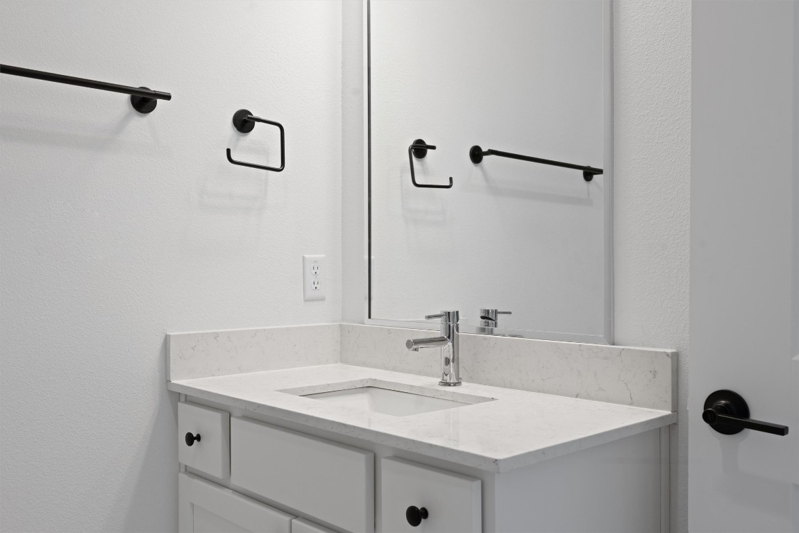 5315 La Crosse Avenue, Unit 18 Austin, TX 78739 - Photo 8 of 40 Bathroom with vanity and a textured wall