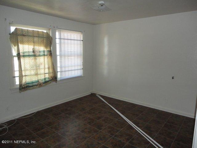 5706 Silver Street Jacksonville, FL 32208 - Photo 2 of 8 an empty room with a window