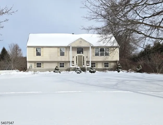a living room with a flat screen tv and a fireplace