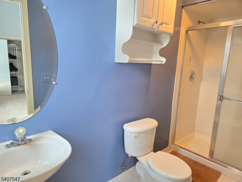 63 Halsey Road Newton, NJ 07860 - Photo 13 of 35 a white toilet sitting next to a bathroom sink