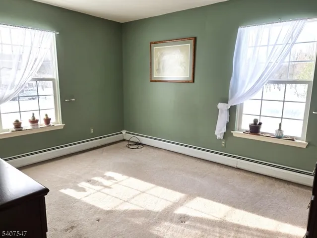 a view of a room with a large window