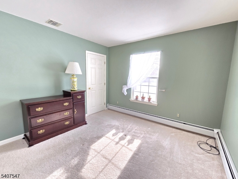 63 Halsey Road Newton, NJ 07860 - Photo 15 of 35 a room with a bed and a window