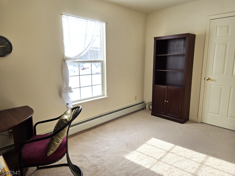 63 Halsey Road Newton, NJ 07860 - Photo 17 of 35 a room with a chair and a window