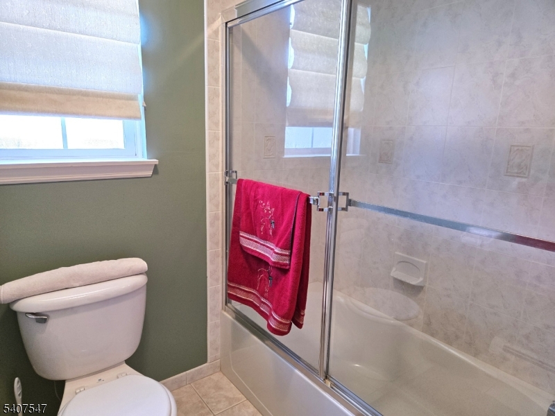 63 Halsey Road Newton, NJ 07860 - Photo 19 of 35 a bathroom with a toilet and a shower
