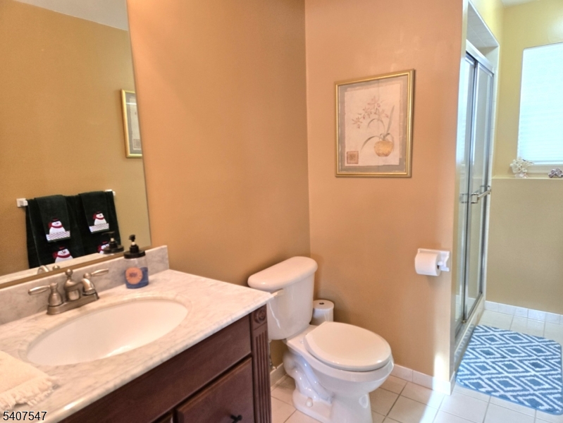 63 Halsey Road Newton, NJ 07860 - Photo 23 of 35 a bathroom with a sink toilet and mirror