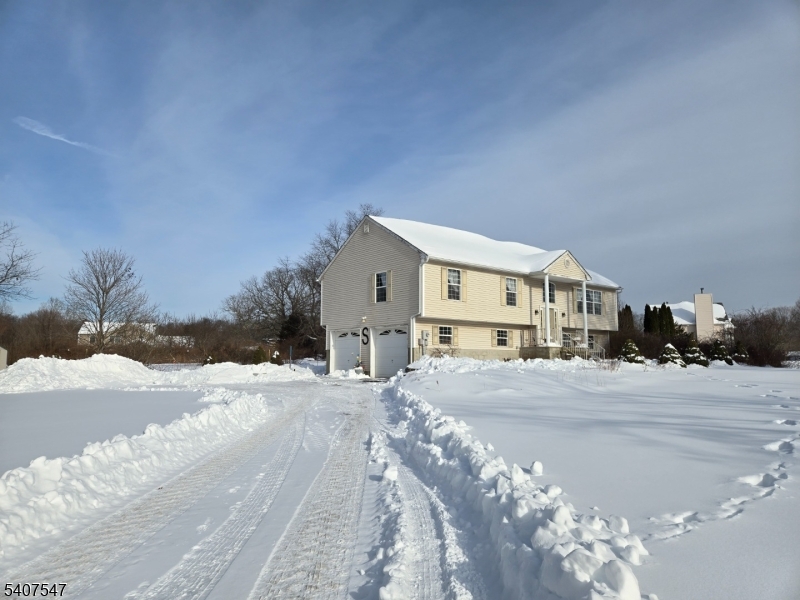 63 Halsey Road Newton, NJ 07860 - Photo 26 of 35 a view of a house with a snow in the yard