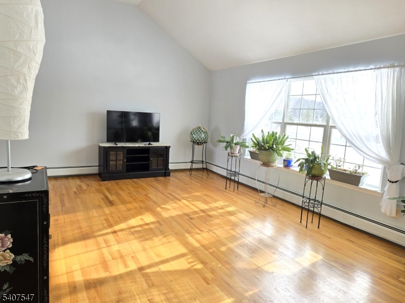63 Halsey Road Newton, NJ 07860 - Photo 4 of 35 a living room with a flat screen tv and a fireplace