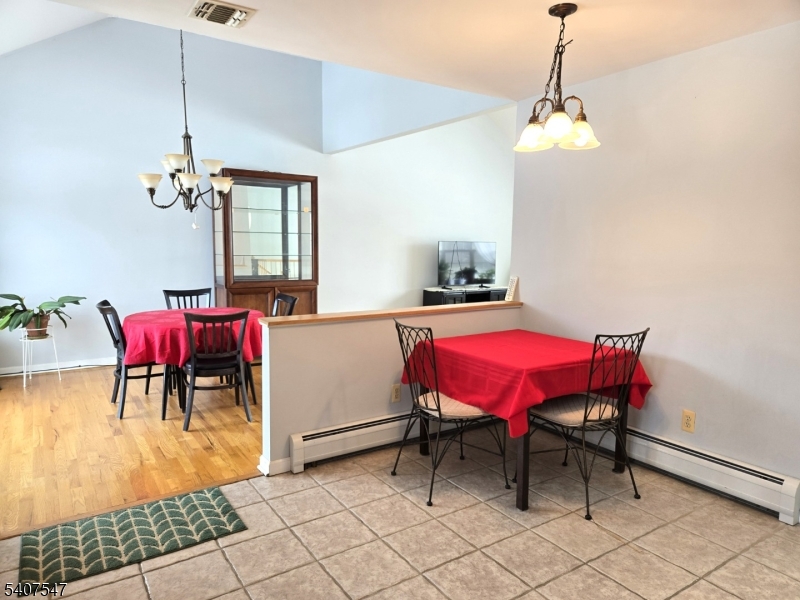 63 Halsey Road Newton, NJ 07860 - Photo 7 of 35 a view of a dining room with furniture and chandelier