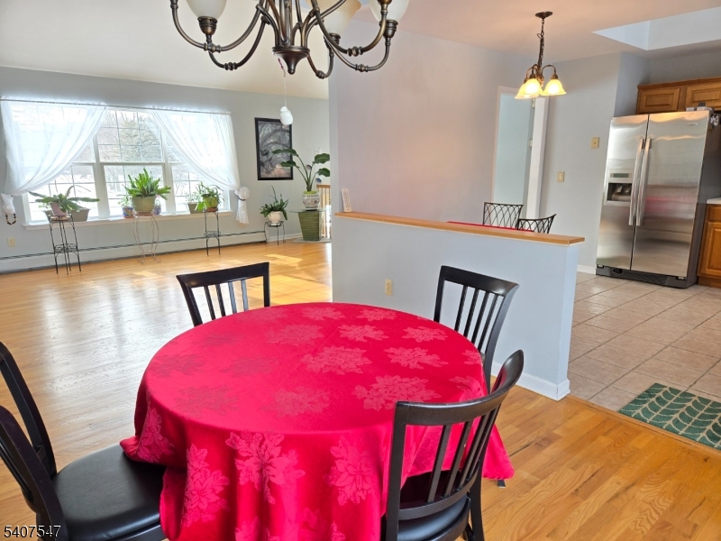 63 Halsey Road Newton, NJ 07860 - Photo 8 of 35 a view of a dining room with furniture and a chandelier