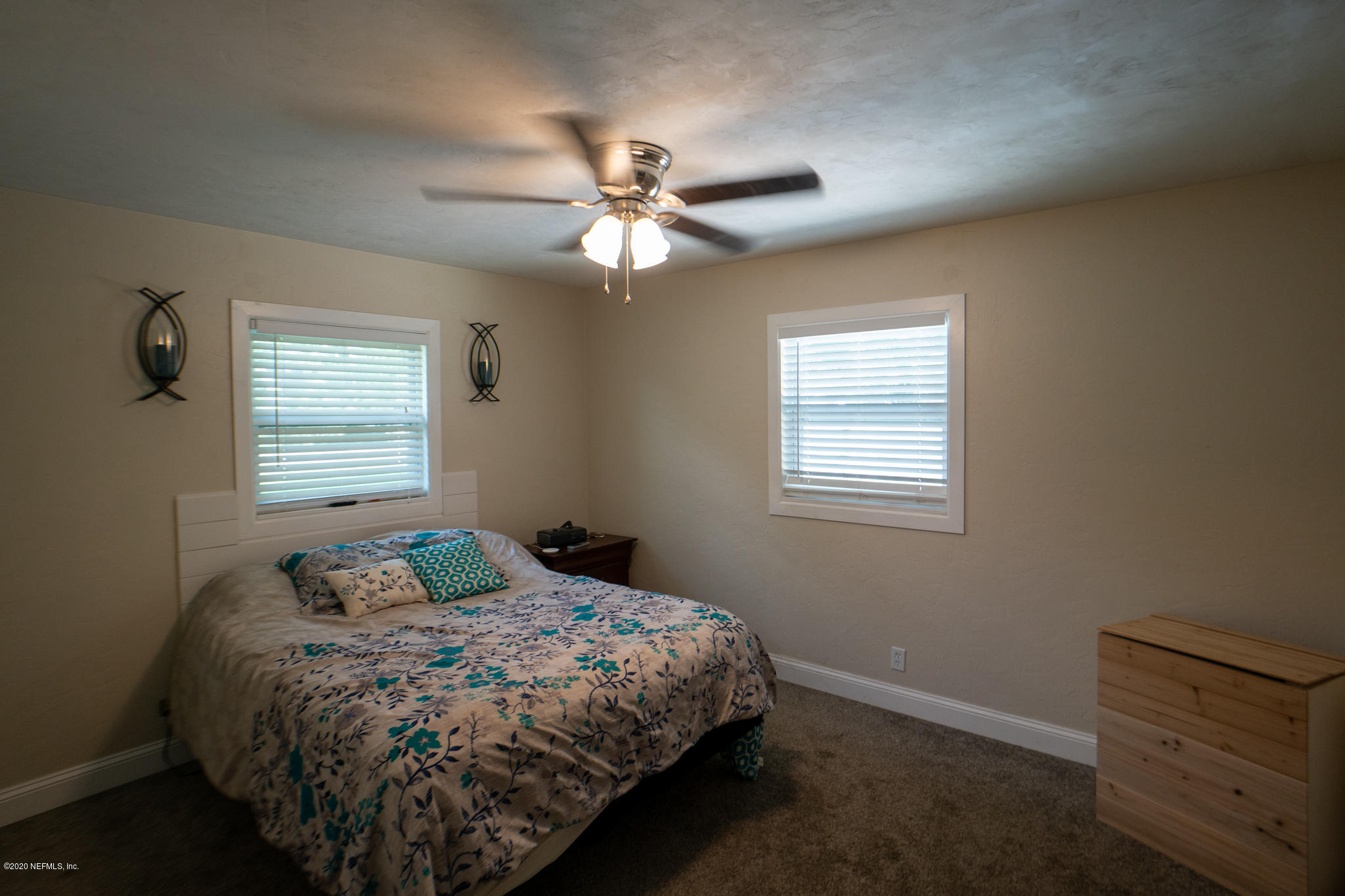 655 Pointview Road Keystone Heights, FL 32656 - Photo 13 of 38 a bedroom with a bed and a window