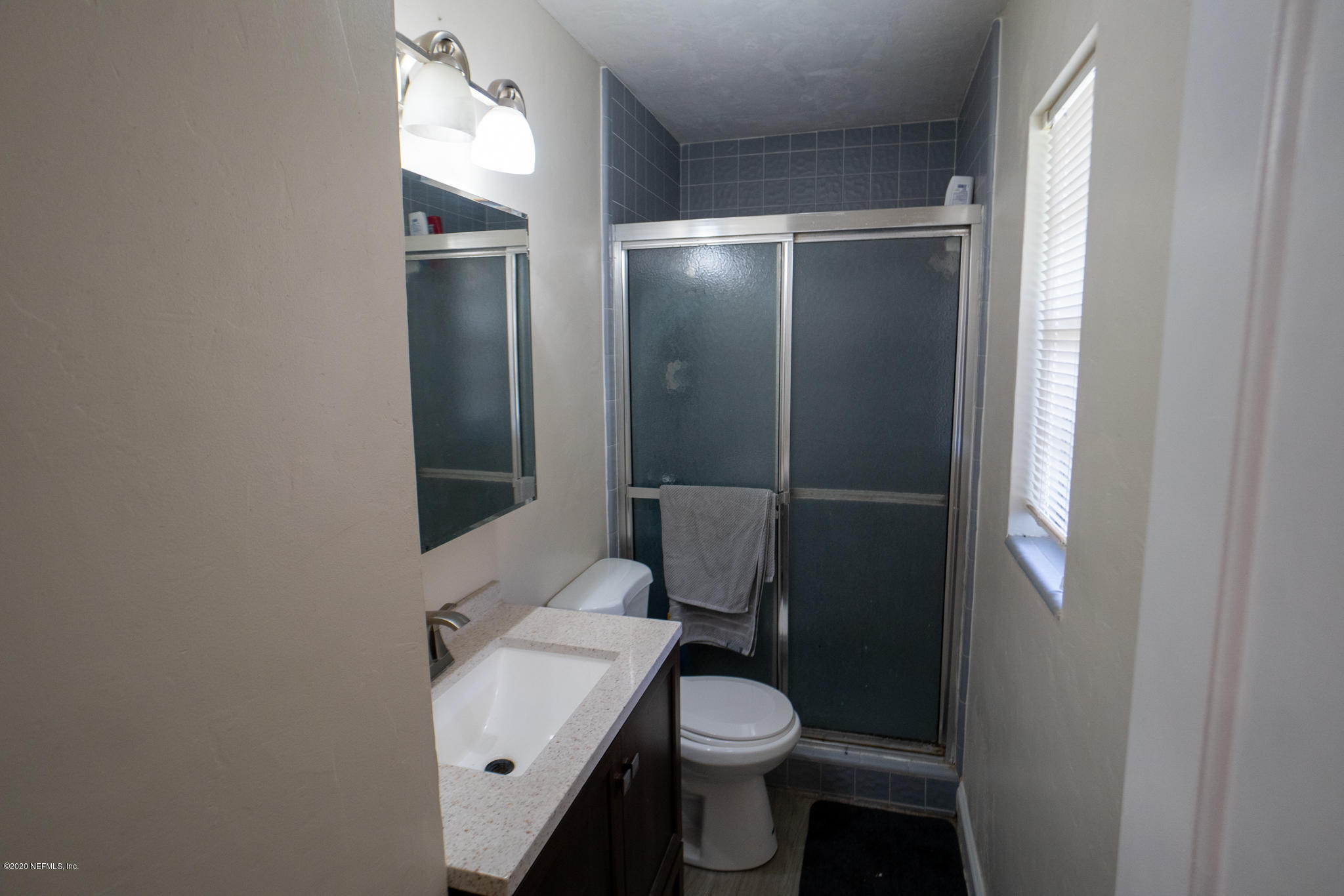 655 Pointview Road Keystone Heights, FL 32656 - Photo 16 of 38 a white toilet sitting next to a bathroom sink