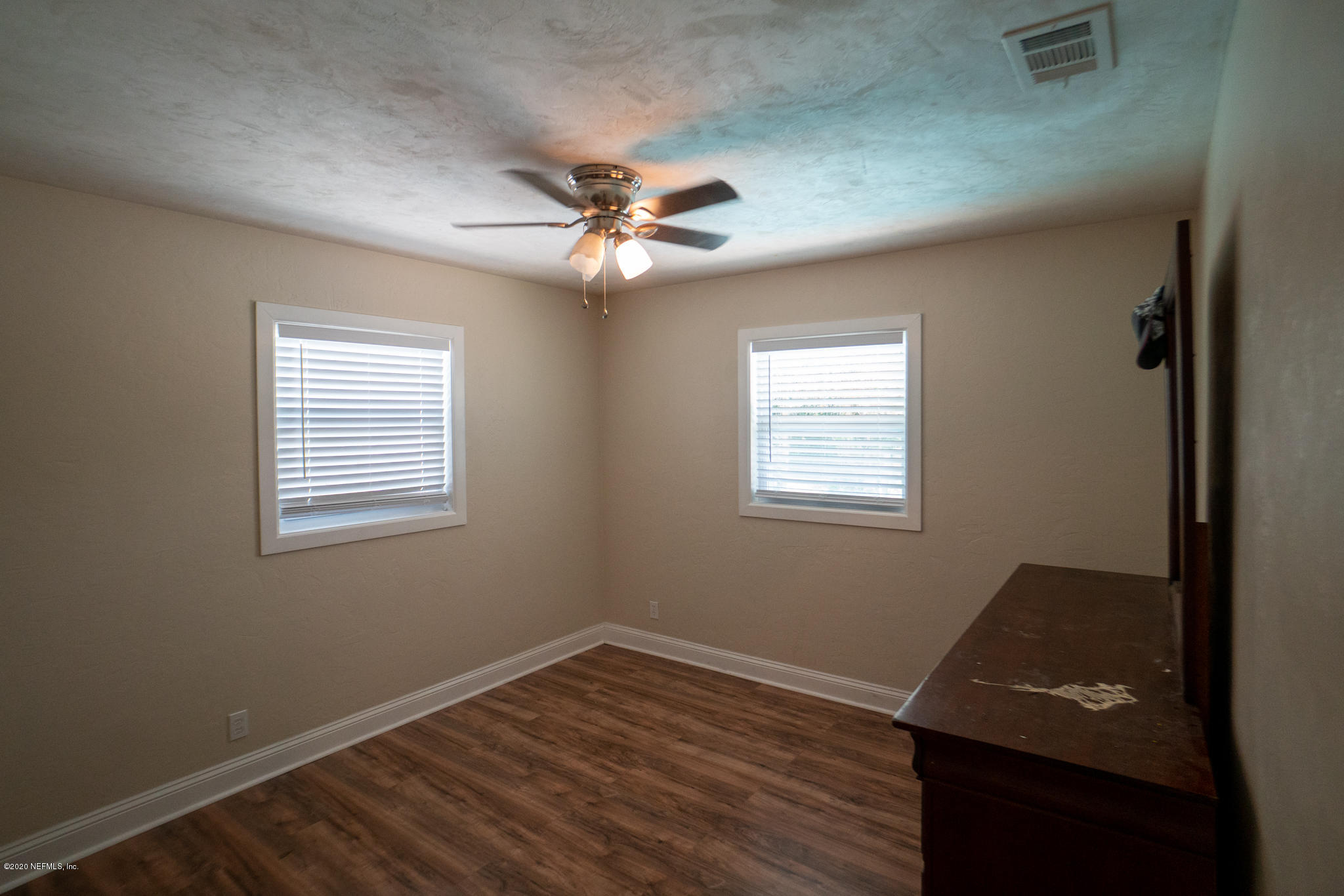 655 Pointview Road Keystone Heights, FL 32656 - Photo 21 of 38 a view of a room with wooden floor and windows