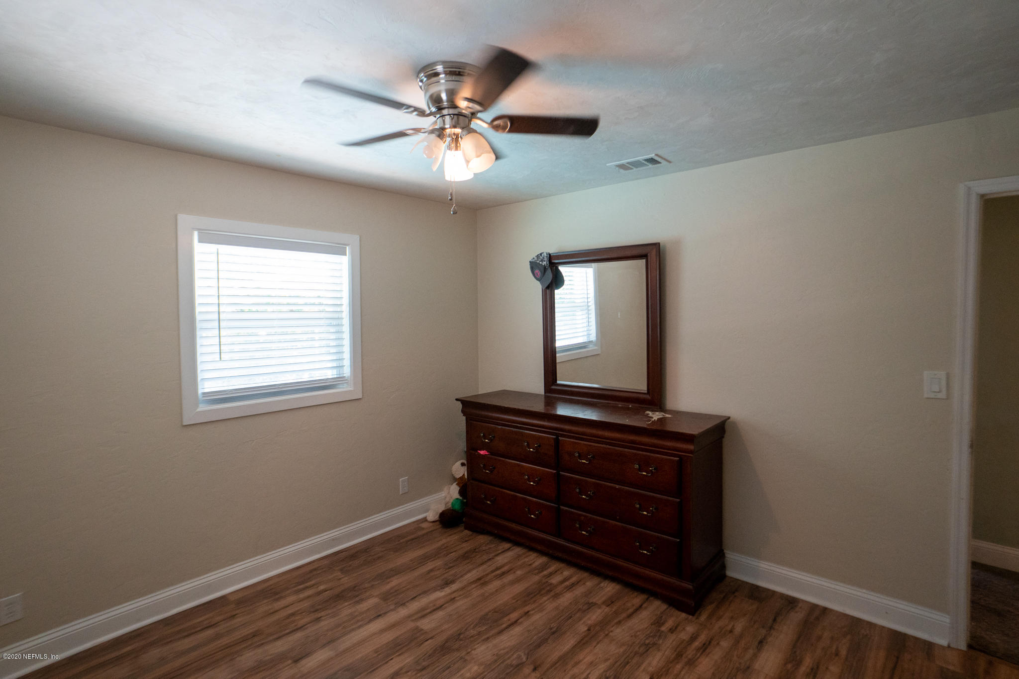655 Pointview Road Keystone Heights, FL 32656 - Photo 23 of 38 a view of room with wooden floor fan and windows
