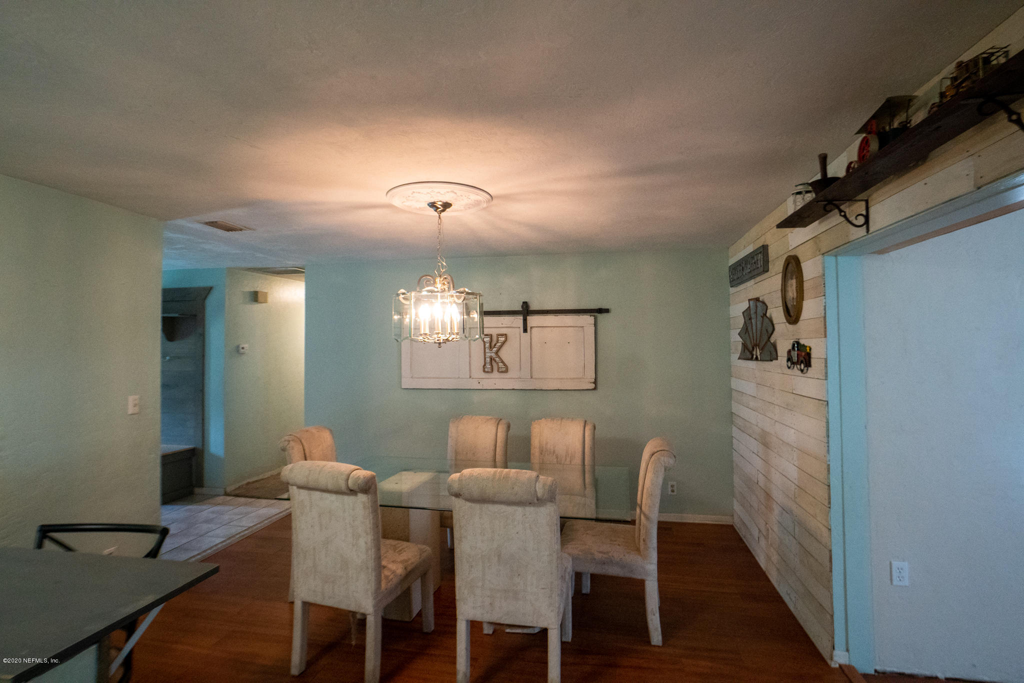 655 Pointview Road Keystone Heights, FL 32656 - Photo 27 of 38 a view of a dining room with furniture and wooden floor