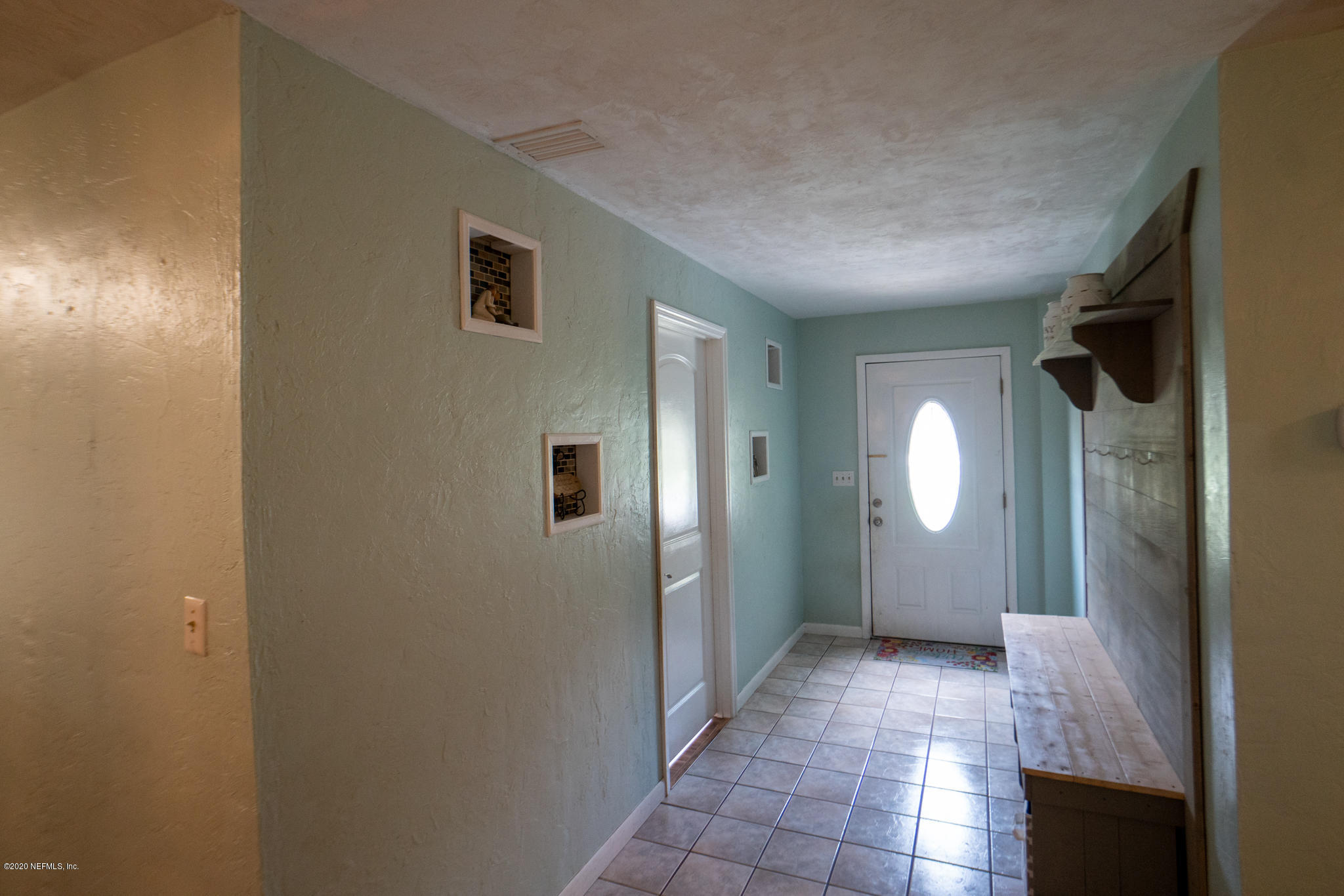 655 Pointview Road Keystone Heights, FL 32656 - Photo 28 of 38 a view of a hallway with wooden floor and windows