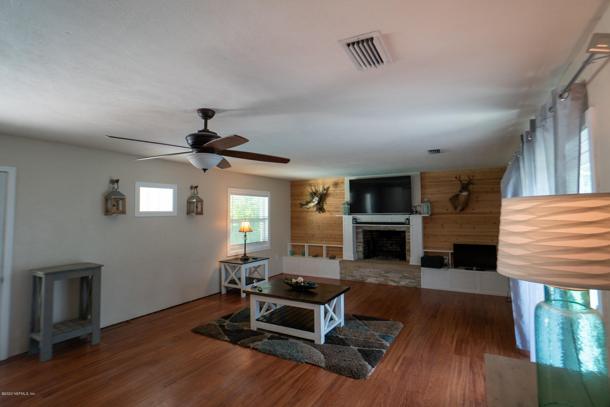 655 Pointview Road Keystone Heights, FL 32656 - Photo 5 of 38 a living room with furniture and a fireplace