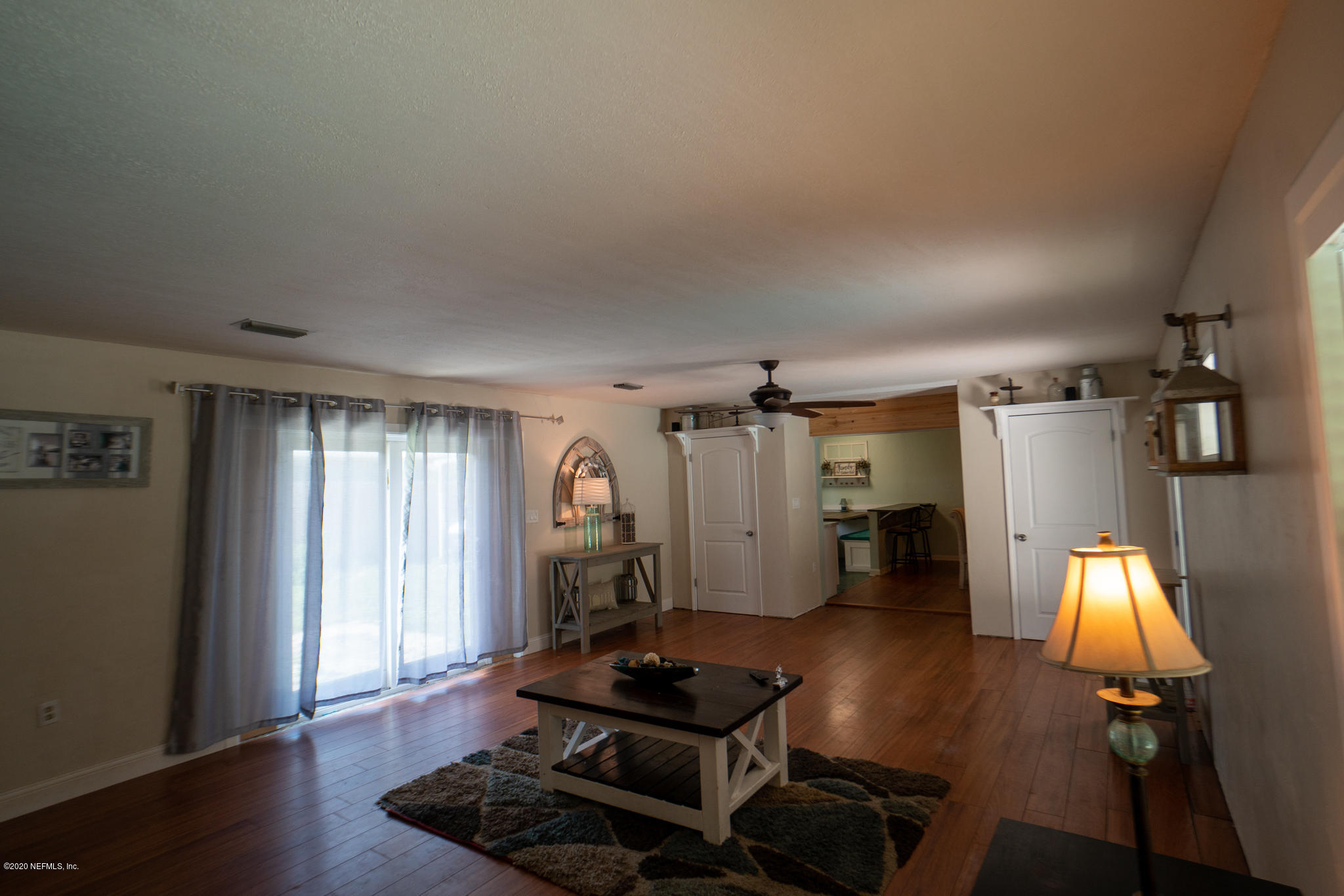 655 Pointview Road Keystone Heights, FL 32656 - Photo 7 of 38 a room with furniture and wooden floor