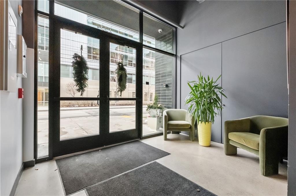 2554 Smallman Street, Unit 501 Pittsburgh, PA 15222 - Photo 2 of 45 a living room with furniture and a potted plant