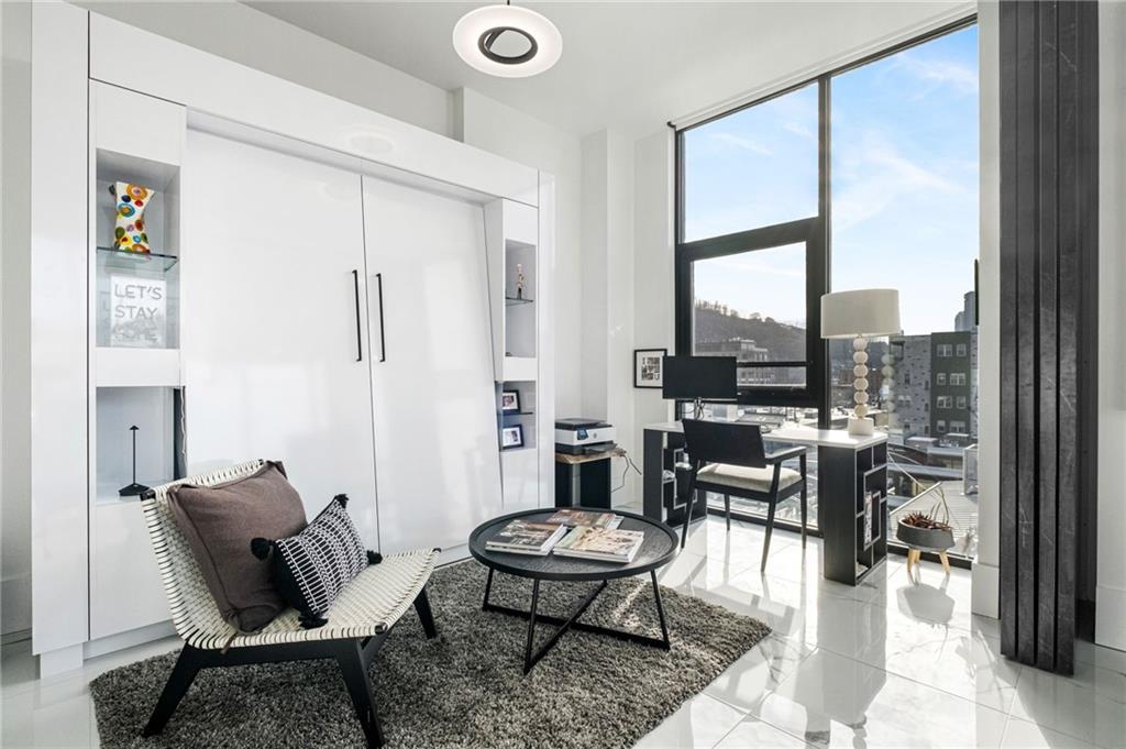 2554 Smallman Street, Unit 501 Pittsburgh, PA 15222 - Photo 21 of 45 a living room with furniture and a large window