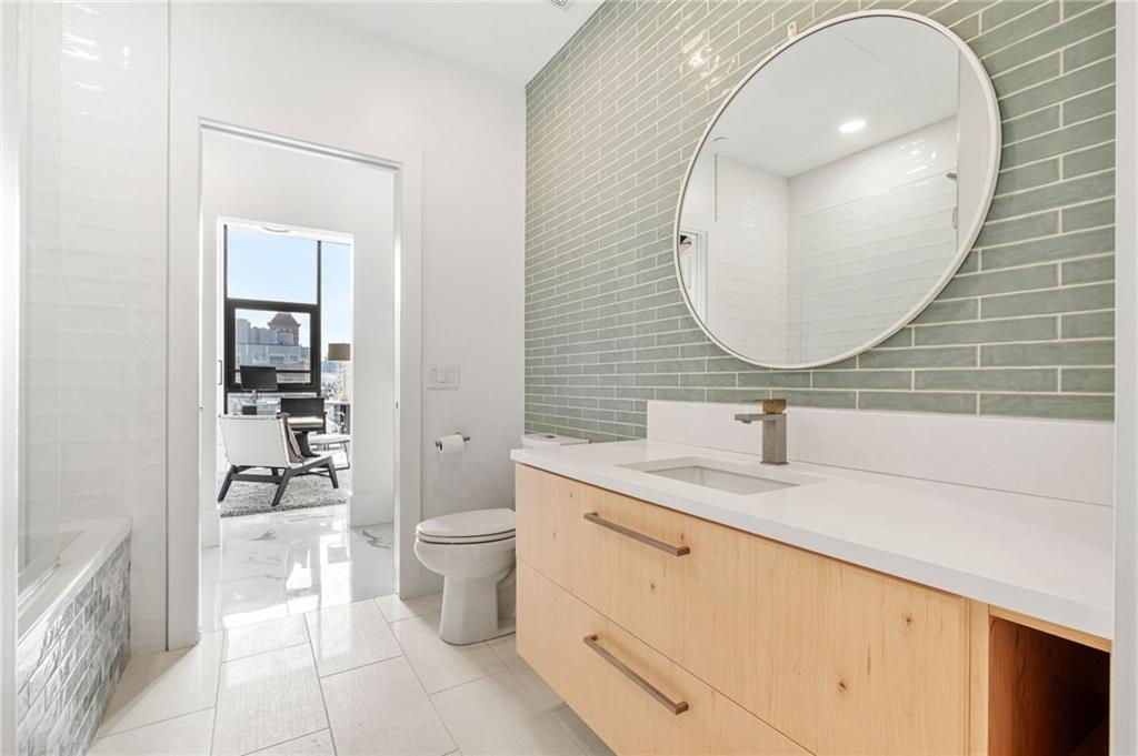 2554 Smallman Street, Unit 501 Pittsburgh, PA 15222 - Photo 28 of 45 a bathroom with a toilet a sink and mirror