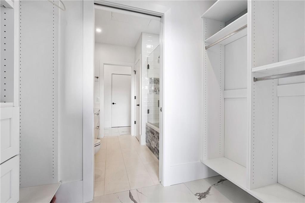 2554 Smallman Street, Unit 501 Pittsburgh, PA 15222 - Photo 31 of 45 a bathroom with a double vanity sink and shower