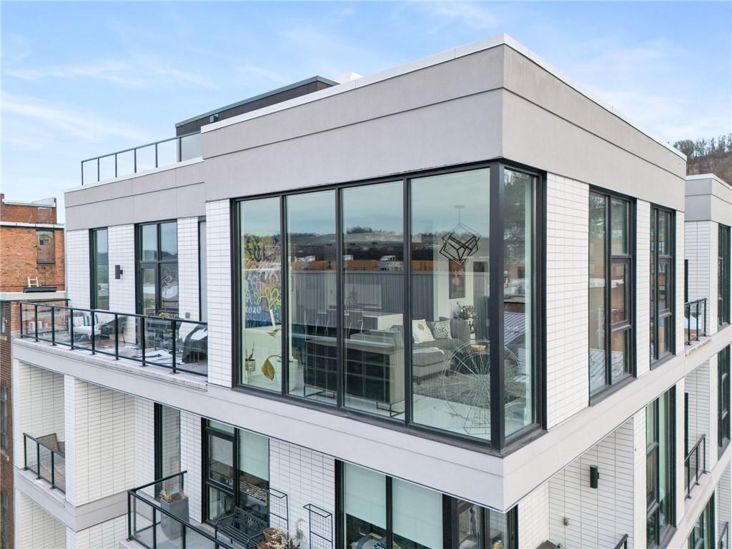 2554 Smallman Street, Unit 501 Pittsburgh, PA 15222 - Photo 42 of 45 a front view of a building with glass windows and door