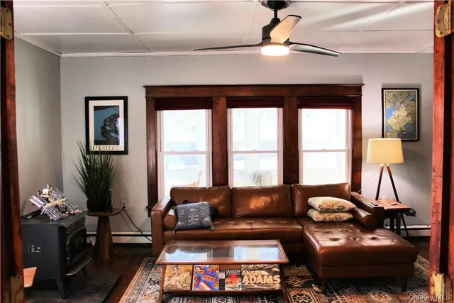 a living room with furniture and flowers