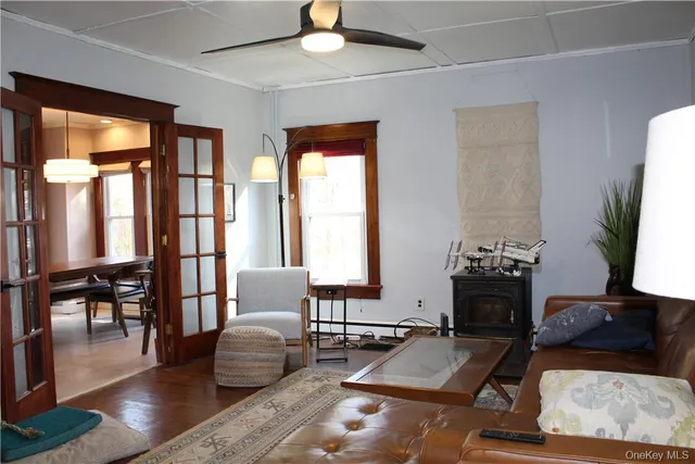 a living room with furniture fireplace and a flat screen tv