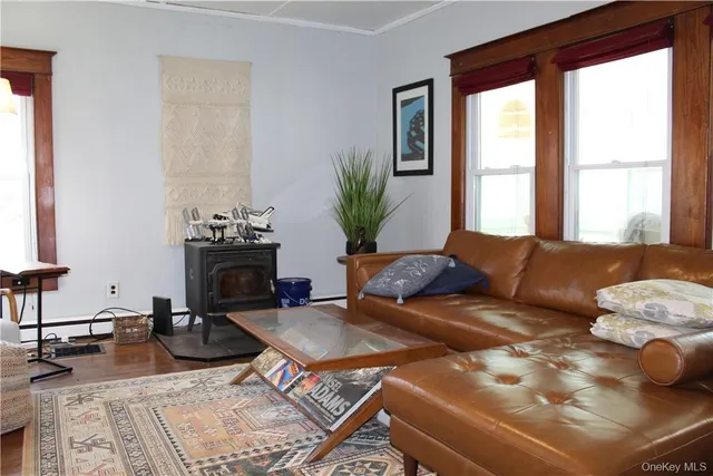 a living room with furniture a fireplace and a table