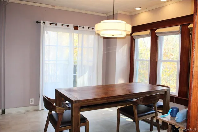 a view of a dining room with furniture window and outside view