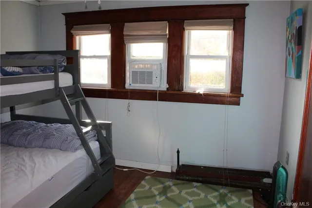 a view of a room with rack on the wall and a window