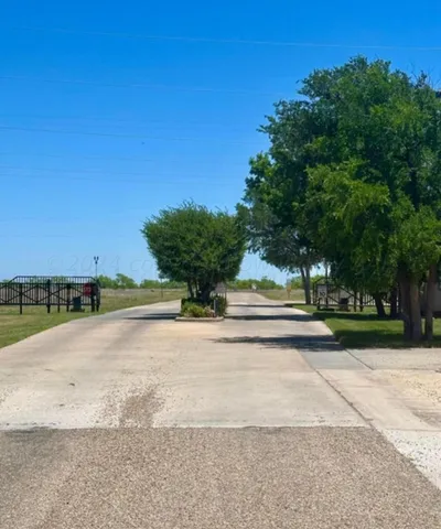 a view of a yard with a house