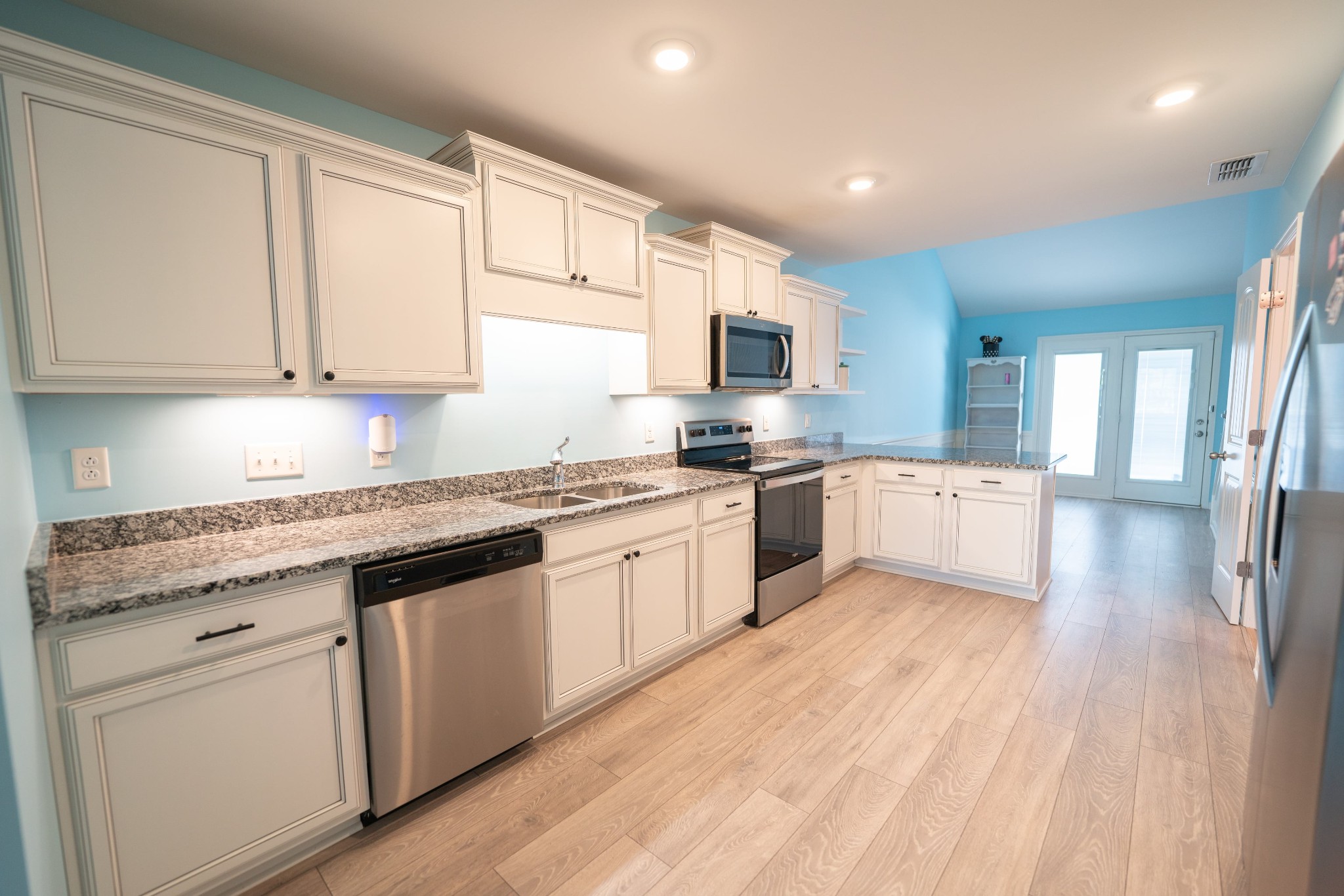 2044 Alysheba Run Murfreesboro, TN 37128 - Photo 5 of 21 a large kitchen with granite countertop a stove top oven a sink a counter space and cabinets