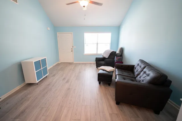 a living room with furniture and a window