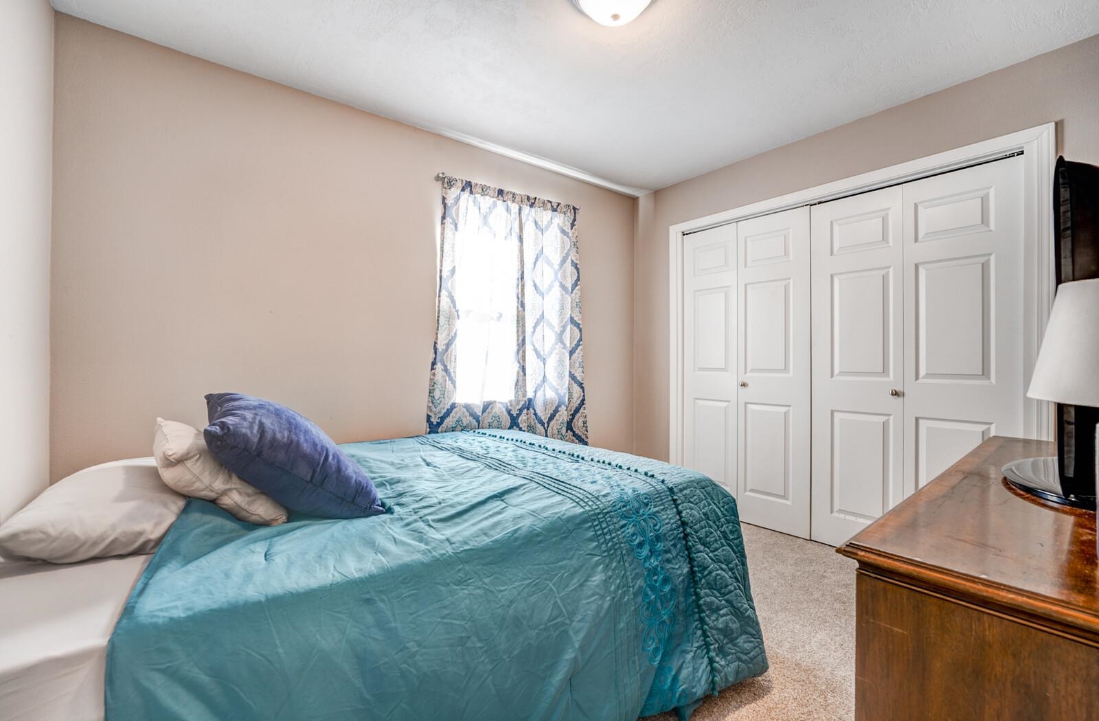 10 Raphael Cove Munford, TN 38058 - Photo 15 of 23 a bedroom with a bed and a window