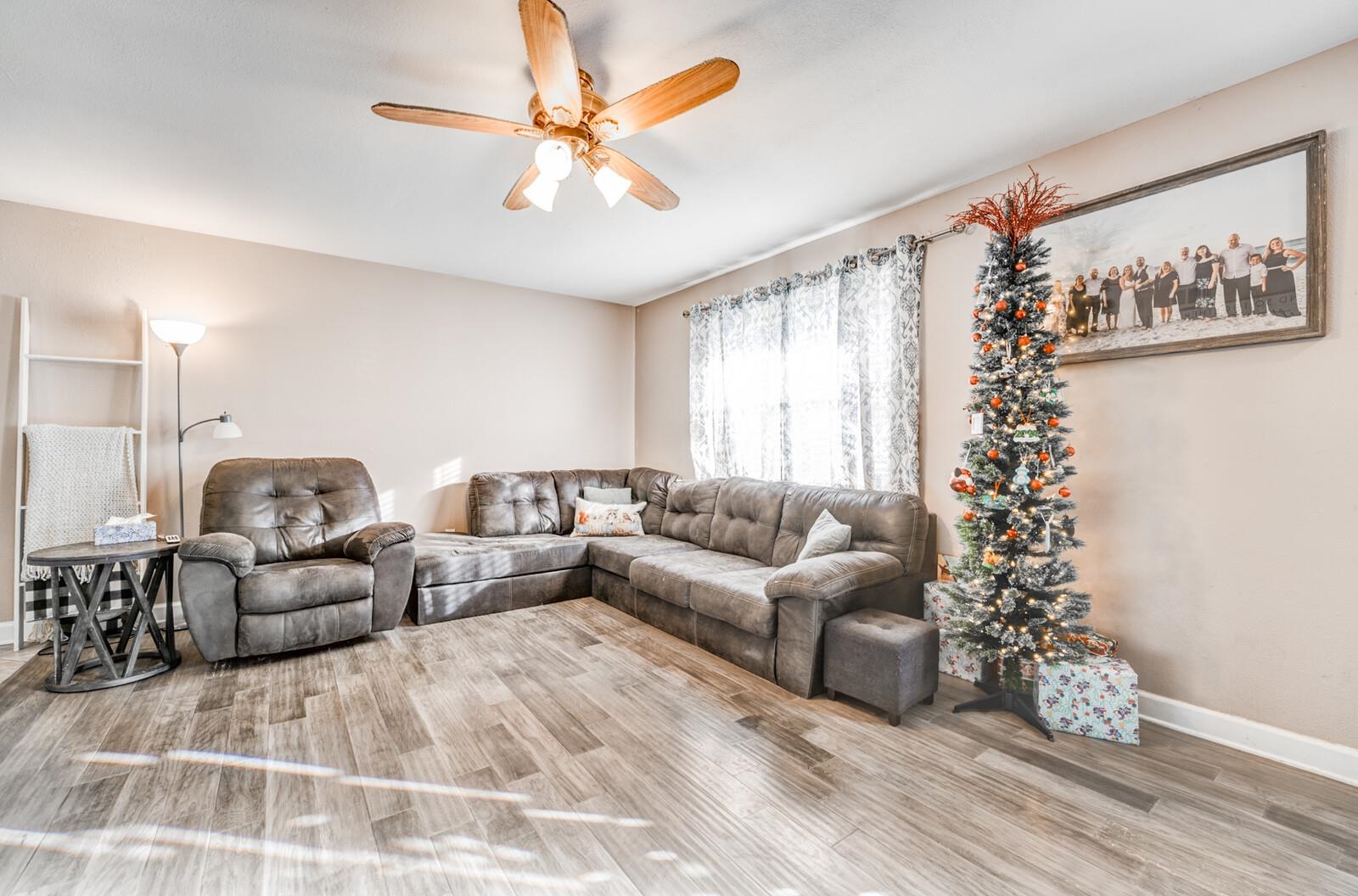 10 Raphael Cove Munford, TN 38058 - Photo 2 of 23 a living room with furniture and a large window