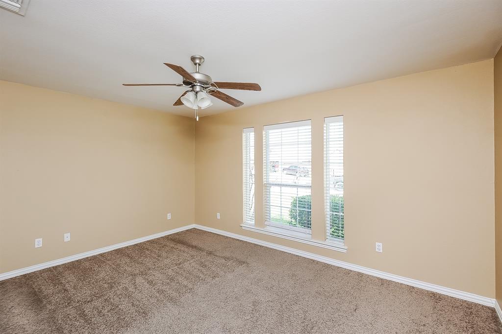 113 Currie Court Crowley, TX 76036 - Photo 8 of 16 a view of a livingroom with a ceiling fan and window