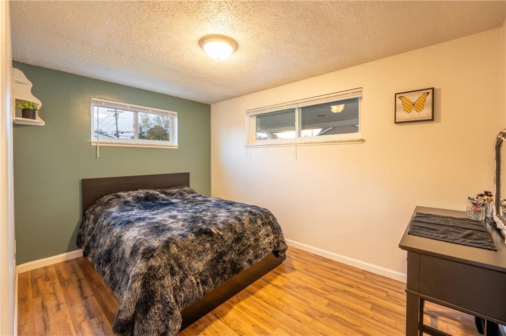 136 Long Drive Irwin, PA 15642 - Photo 15 of 50 a bedroom with a bed and wooden floor