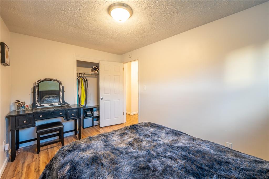 136 Long Drive Irwin, PA 15642 - Photo 16 of 50 a bedroom with a bed and a piano in it