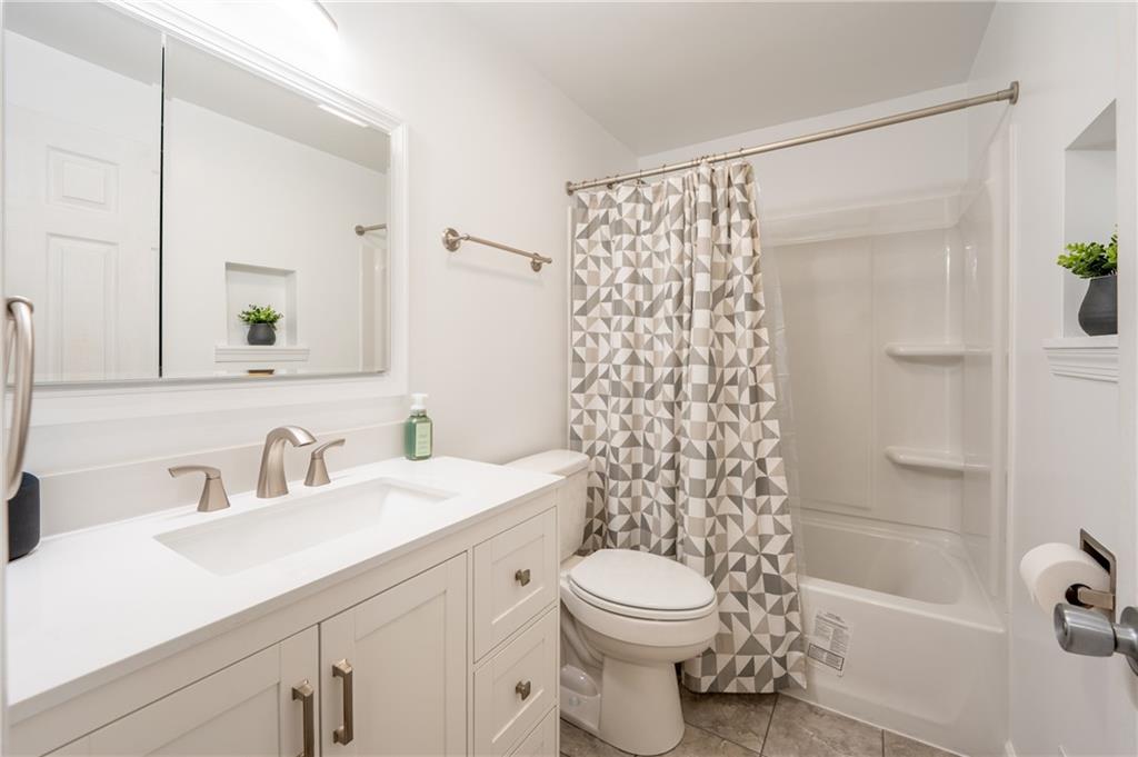 136 Long Drive Irwin, PA 15642 - Photo 19 of 50 a bathroom with a sink a toilet and shower