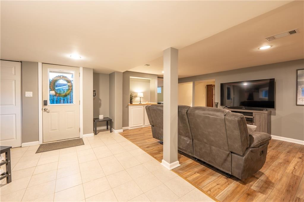 136 Long Drive Irwin, PA 15642 - Photo 23 of 50 a living room with furniture and a flat screen tv