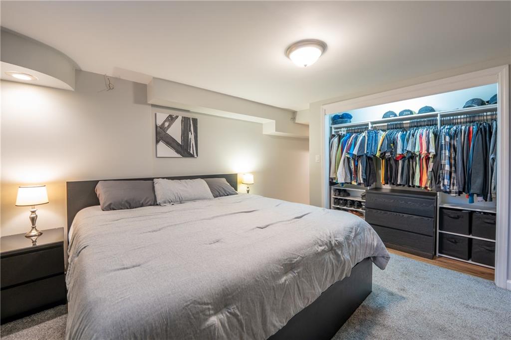 136 Long Drive Irwin, PA 15642 - Photo 25 of 50 a bedroom with a large bed and a walk in closet