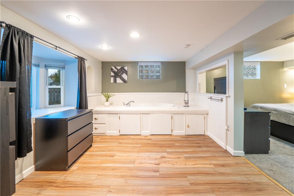 136 Long Drive Irwin, PA 15642 - Photo 26 of 50 a spacious bathroom with a double vanity sink a mirror and a bathtub