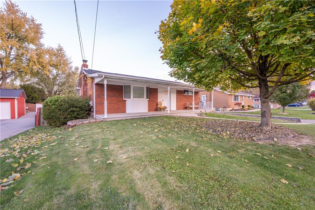 136 Long Drive Irwin, PA 15642 - Photo 3 of 50 a front view of a house with garden
