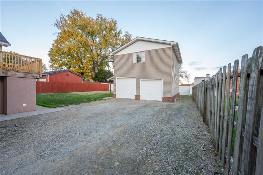 136 Long Drive Irwin, PA 15642 - Photo 37 of 50 a view of a house with a yard and garage