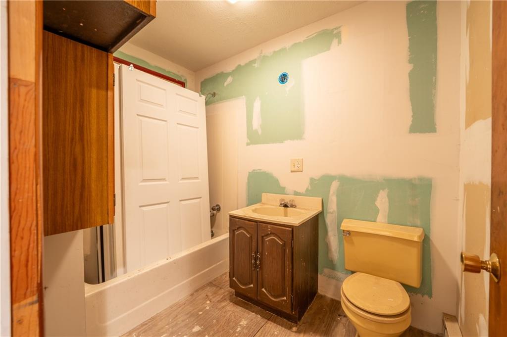 136 Long Drive Irwin, PA 15642 - Photo 44 of 50 a bathroom with a toilet a sink and a mirror